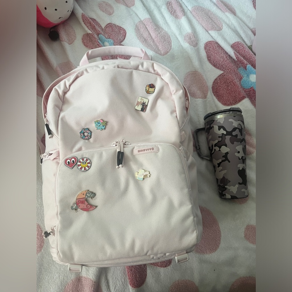 Pink Brevite backpack and brunate cup